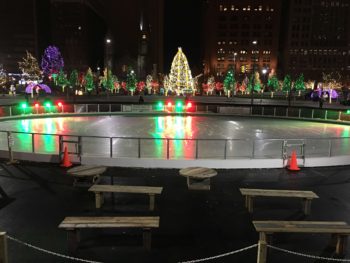 Glass rail system on outdoor rink at night